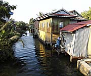 Water Channel and Malay Houses in Kampot by Asienreisender